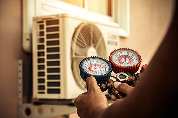 Professional Heat Pump Repair technician working in Rougemont, NC
